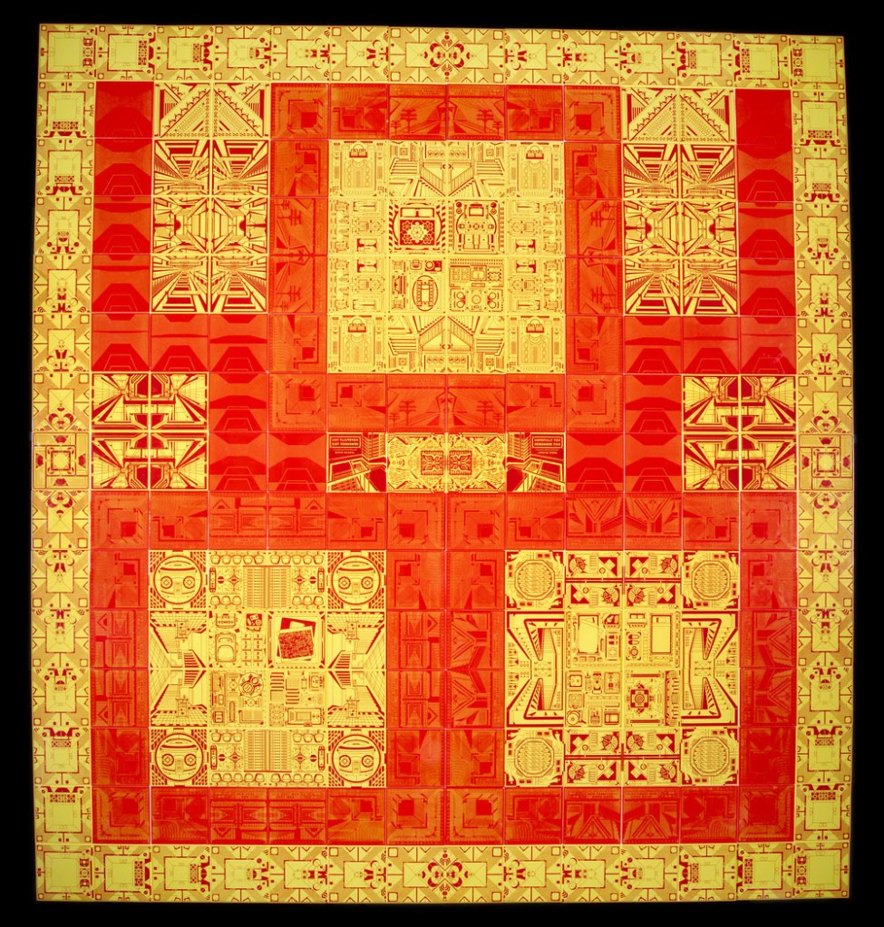 A yellow and red geometric images on tiles